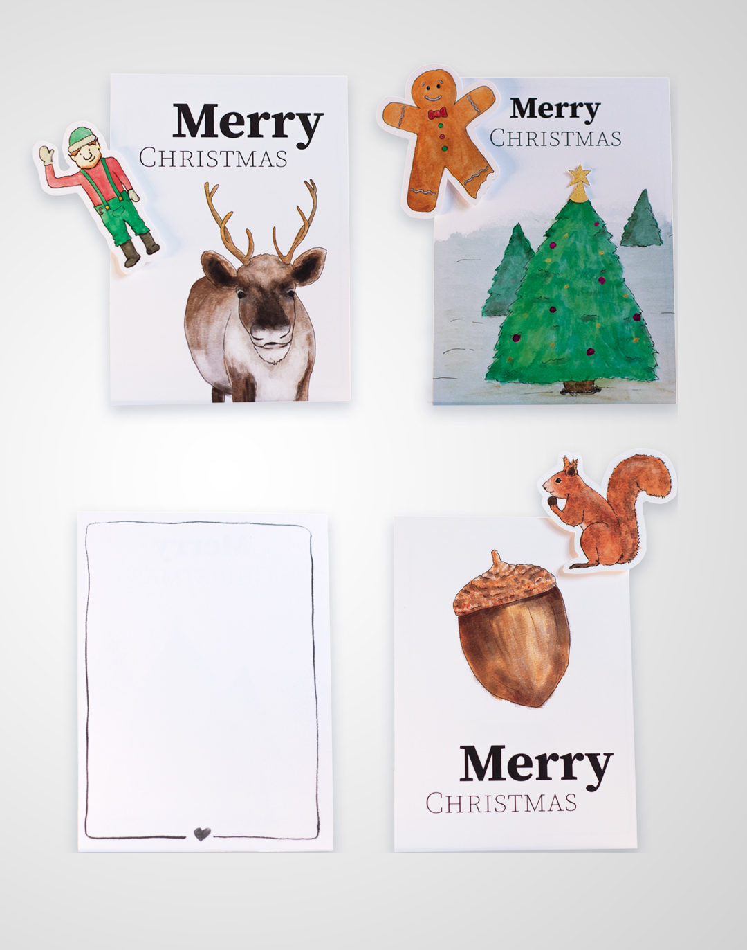 Overzicht van 3 kerstkaarten met Eland en elfje, Kerstboom en gingerbread mannetje, een eikel met een eekhoorntje en de achterkant met getekent randje en een hartje